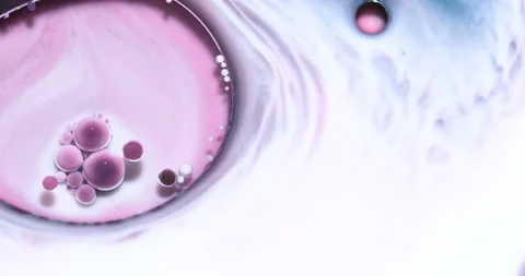 Liquid paint mixing artwork with splash and swirl Stock Footage 153953470