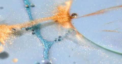 Liquid paint mixing artwork with splash and swirl Stock Footage