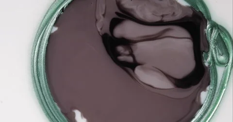 Liquid paint mixing artwork with splash and swirl Stock Footage 153958945