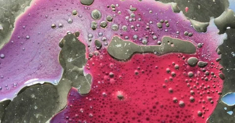 Liquid paint mixing artwork with splash and swirl Stock Footage 160417378