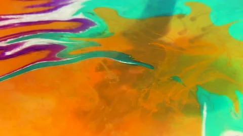 Liquid paint mixing artwork with splash and swirl Stock Footage 165144083