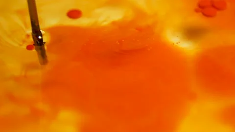 Liquid paint mixing artwork with splash and swirl Stock Footage 165146695