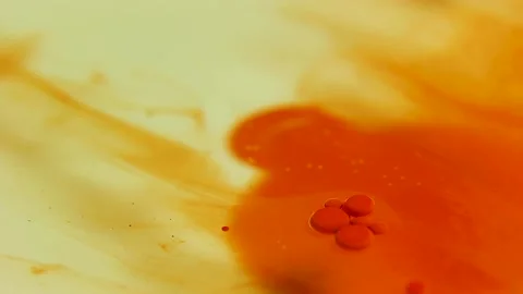 Liquid paint mixing artwork with splash and swirl Stock Footage 165146979