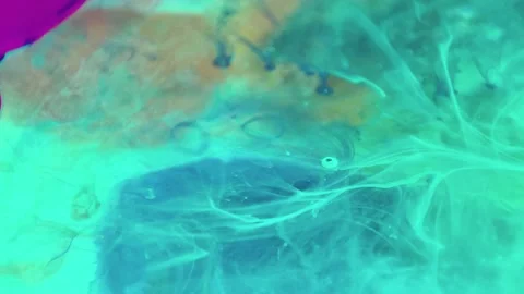 Liquid paint mixing artwork with splash and swirl Stock Footage 165162518