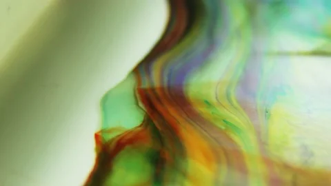 Liquid paint mixing artwork with splash and swirl Video stock 165165088