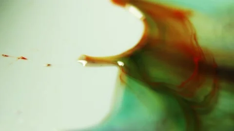 Liquid paint mixing artwork with splash and swirl Stock Footage 165165114