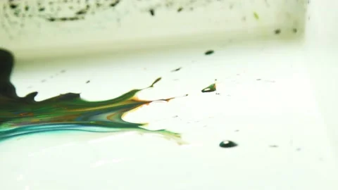 Liquid paint mixing artwork with splash and swirl Video stock 165166362