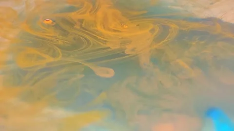 Liquid paint mixing artwork with splash and swirl Stock Footage 165172225
