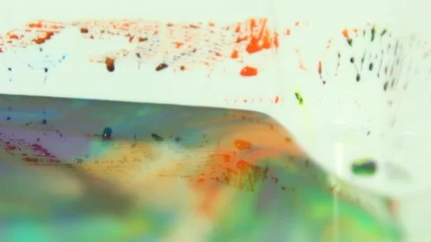 Liquid paint mixing artwork with splash and swirl Stock Footage 165185074