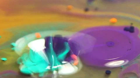 Liquid paint mixing artwork with splash and swirl Video stock 165186537