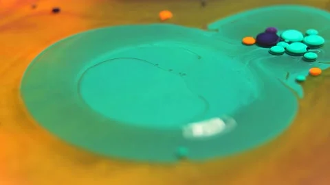 Liquid paint mixing artwork with splash and swirl Stock Footage 165187741