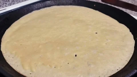 Liquid pancake dough on hot surface Video stock 163865410