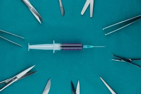 Liquid parenteral products in syringe with basic surgical instrument 写真素材