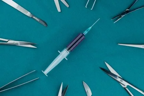 Liquid parenteral products in syringe with basic surgical instrument 写真素材