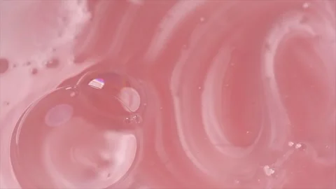 Liquid pink shampoo texture background, washing gel, soap. Pearlescent surface Stock Footage 341323232
