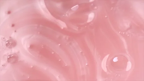 Liquid pink soap, shampoo, washing gel texture. Pearlescent surface 動画素材 340076128