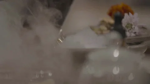 Liquid poured into dish creating steam Stock Footage 335703237
