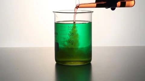 Liquid pouring into a beaker Stock Footage 95967671