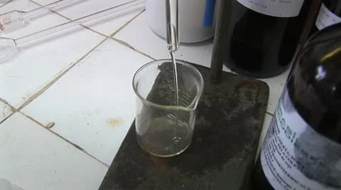 Liquid Pouring Into a Measuring Cup From A Large Funnel 動画素材 18970112