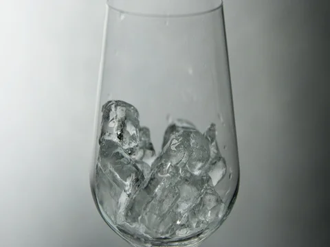 Liquid pouring over ice in Slow motion Stock Footage 76676705