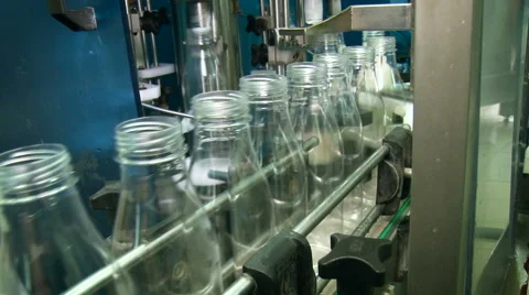 Liquid Product Manufacturing. Empty Clean Transparent Bottles Moving in One Stock Footage 68028001