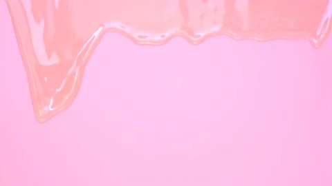 Liquid shampoo dripping down on pink background close-up. Stock Footage 211991692