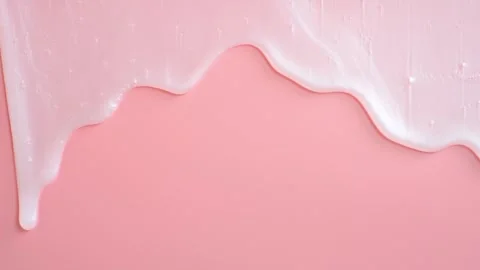 Liquid shampoo or shower gel dripping down on pink background close-up. Stock Footage 251694232