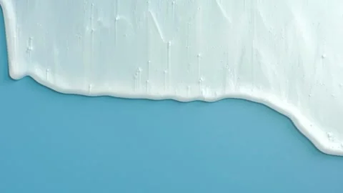 Liquid shampoo or shower gel dripping down on blue background close up. Stock Footage 251765951