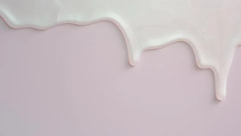 Liquid shampoo or shower gel dripping down on light pink background close-up. Stock Footage 251857515