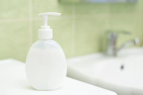 Liquid soap in bathroom Stock Photos
