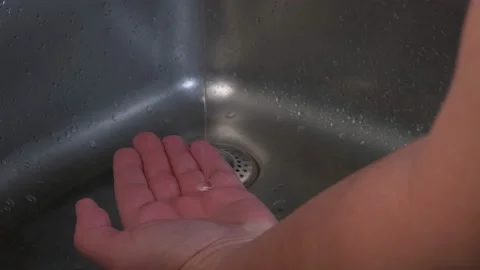 Liquid soap falls on the man's hand, after which the palms Stock Footage 150974283