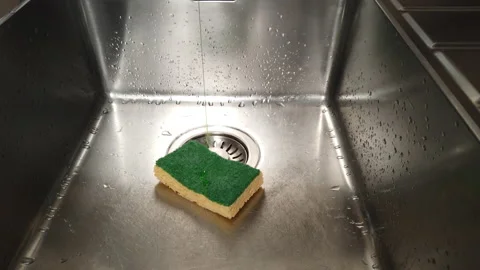 Liquid soap falls on a washing-up sponge Stock Footage 238640302
