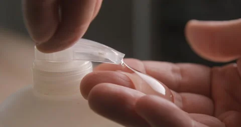 Liquid soap pumping on hands slow motion 4K Stock Footage 232267324