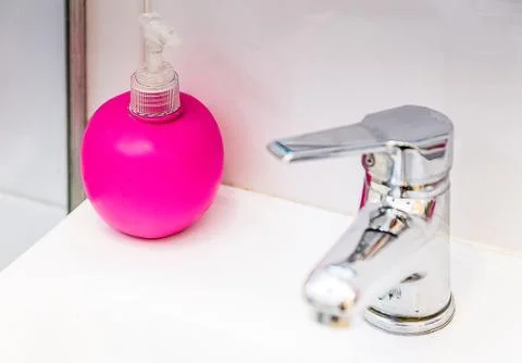 Liquid soap on the sink Stock Photos