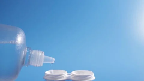 Liquid solution for lenses drips into lens container, Optic clarity, Vision.. Stock Footage 257332137