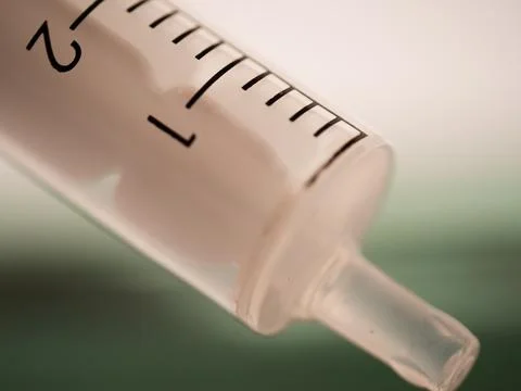 Liquid solution in a syringe close up macro Stock Photos