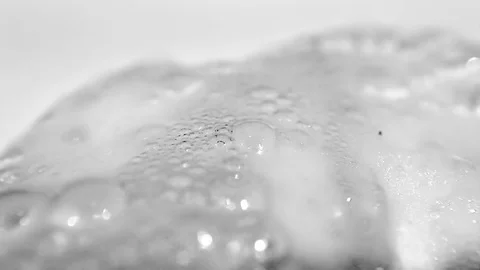 Liquid spills onto hazardous powder to create a chemical reaction Video stock 72219390