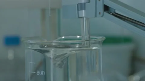 Liquid Is Stirred and a Solution Prepared Stock Footage 61458330