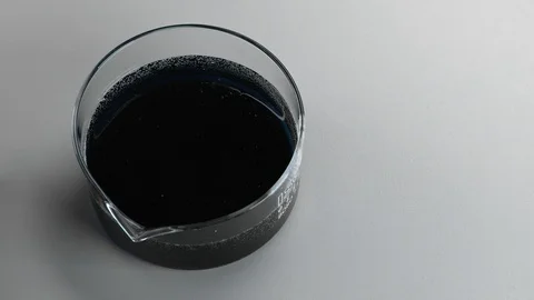 Liquid stirring, mixing with changing colors, swirling process in chemical tests Stock Footage 106454409