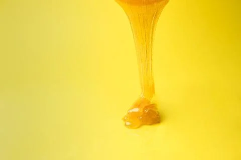 Liquid sugar wax flowing down Stock Photos
