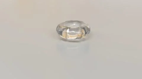Liquid torus shape in a translucent glass-like form on a neutral background.. Stock Photos