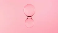 Liquid Transparent Pink Water Ball. 3D 4K Animation Footage. Stock Footage
