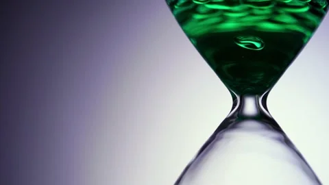 Liquid type of hourglass as time passing concept for business deadline Stock Footage 146364371