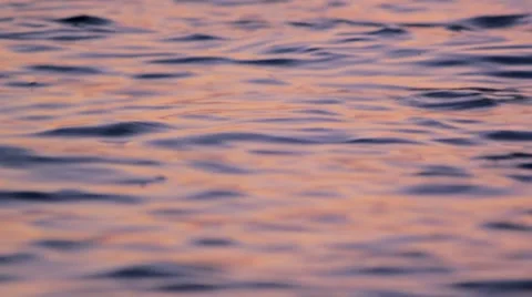 Liquid water waves on sunrise Stock Footage 8761669