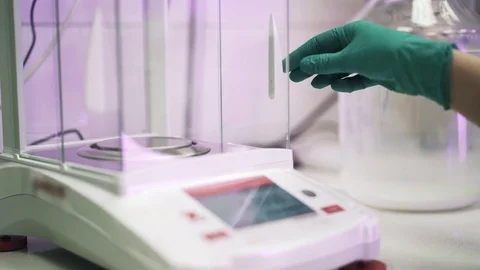 Liquid weighted at electronic scales in a lab 스톡 동영상 75343155