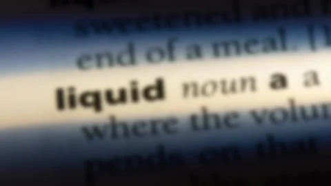 Liquid word in a dictionary. Stock Footage 99562738