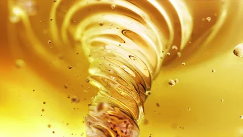 Liquid yellow drink vortex in 4K Stock Footage 90262496
