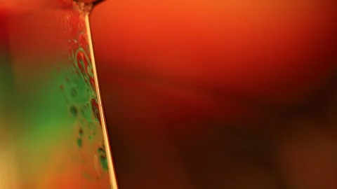 Liquid of yellow mustard color, smooth motion Stock Footage 311879424