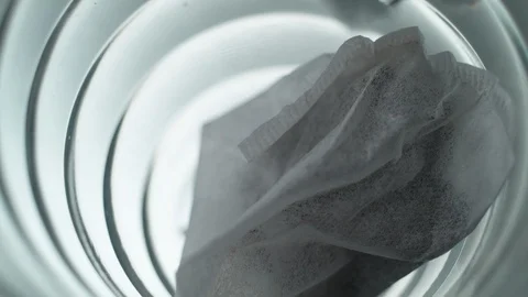 Liquid/Ice falling into a glass in slow motion. Stock Footage 115887633