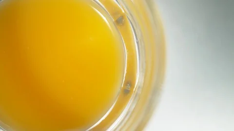 Liquid/Ice falling into a glass in slow motion. Stock Footage 115888285